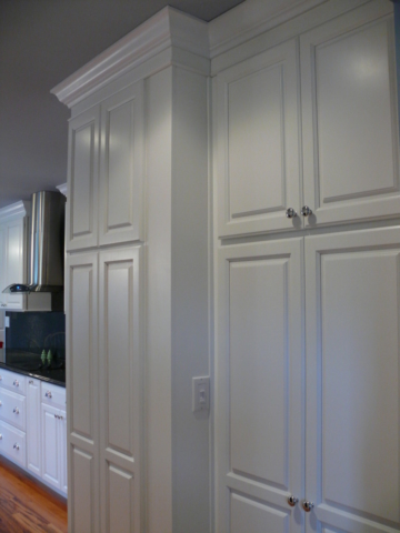 Custom Built pantry and false panel on outside of where fridge was relocated.