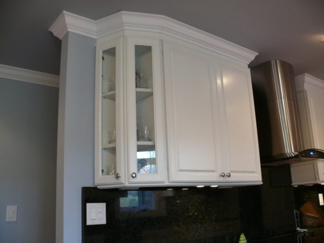 The end of the stairs used to be here now a glass corner cabinet
